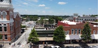 an aerial view of a town with a clock tower
