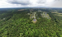 an aerial view of a wooded area
